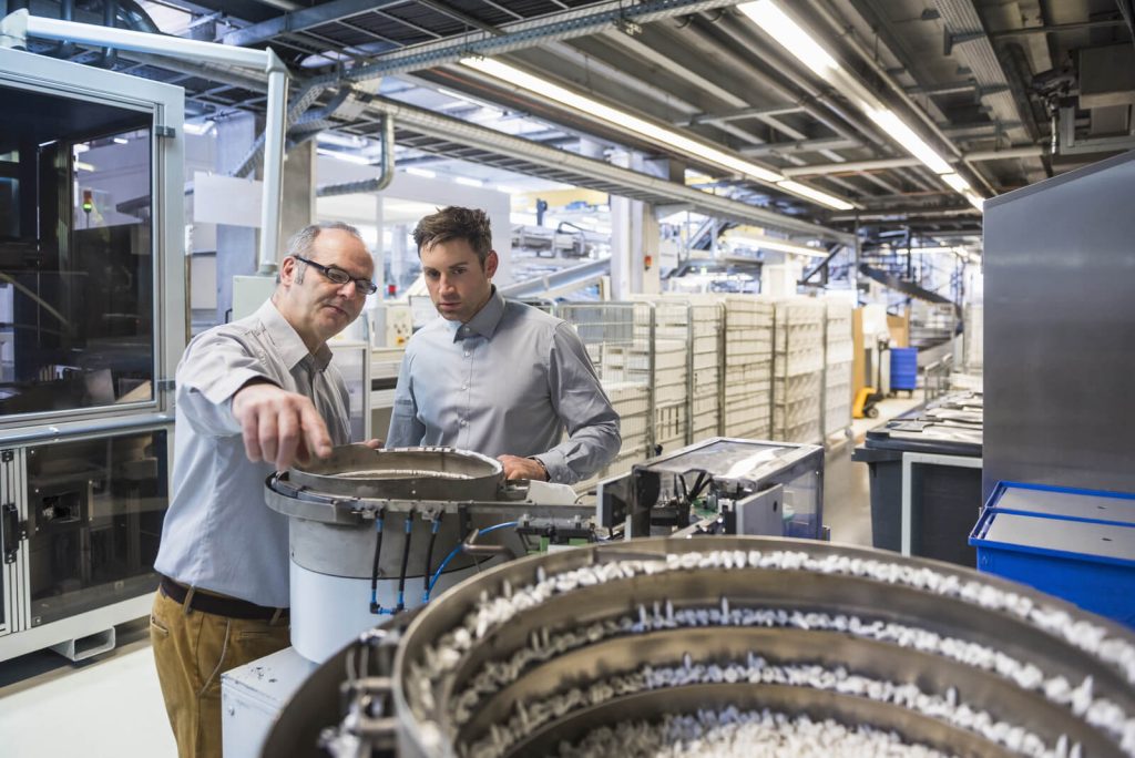 two men in factory shop floor examining outcome of 2024 09 18 15 35 25 utc